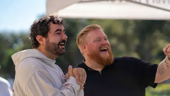 Two men laughing together outdoors